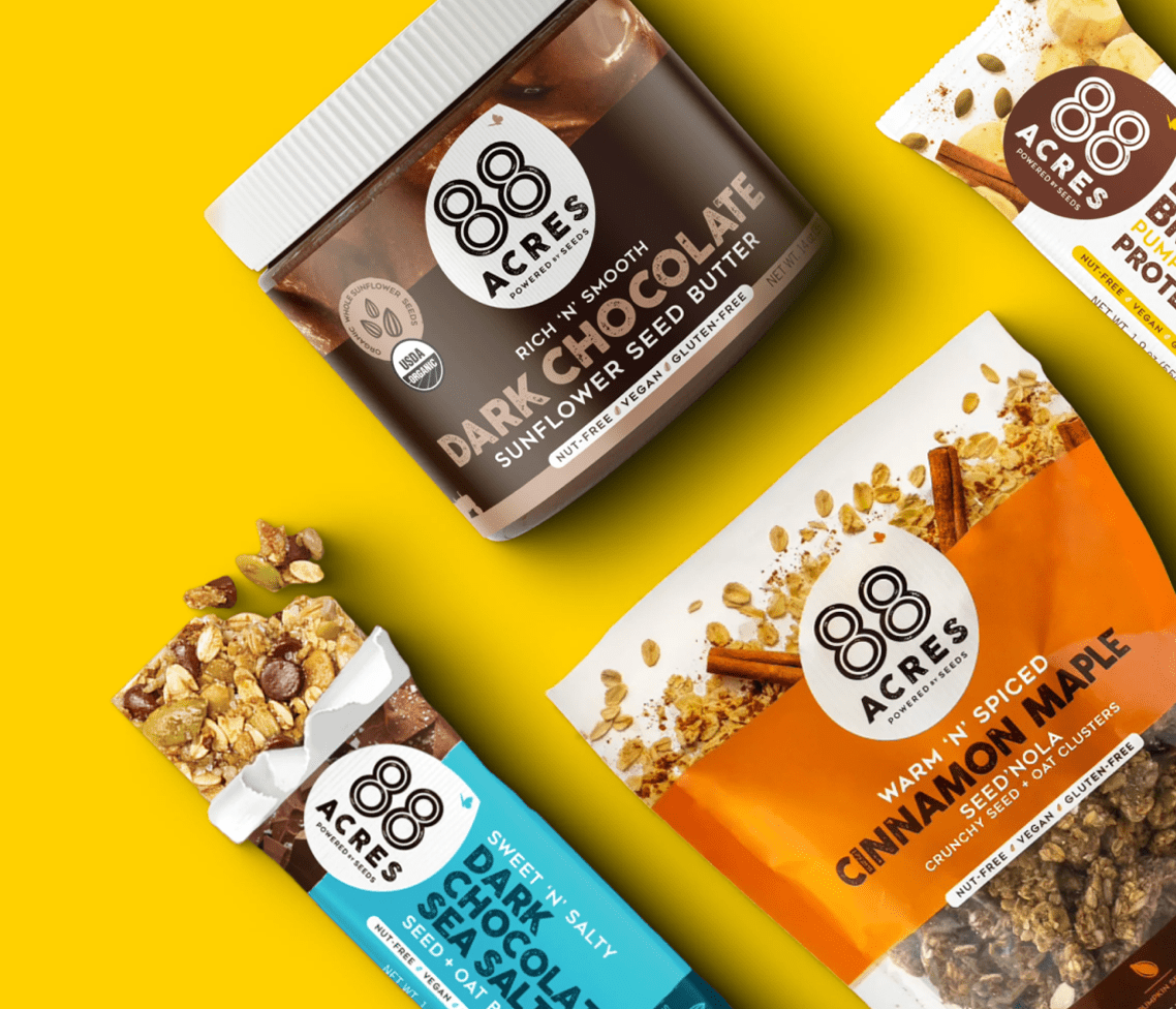 88 Acres snacks—Dark Chocolate Sunflower Seed Butter, Cinnamon Maple, and Dark Chocolate Sea Salt Bars—on a yellow backdrop.